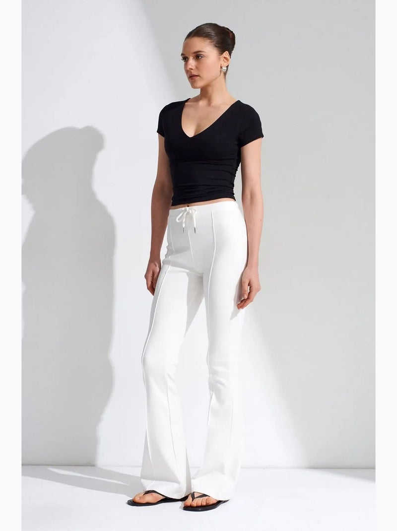 Flared jerseybroek met middelhoge taille en trekkoord dilvin Wit - Kiabi
