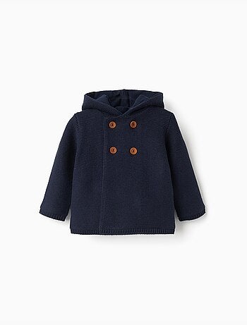 Gebreid vest met capuchon en pomponen