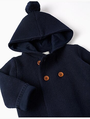 Gebreid vest met capuchon en pomponen