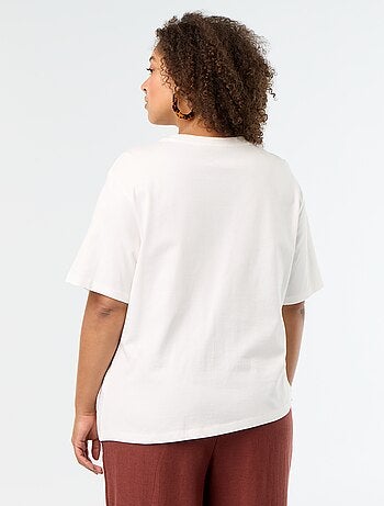 Gedrapeerd T-shirt met goudkleurige broche