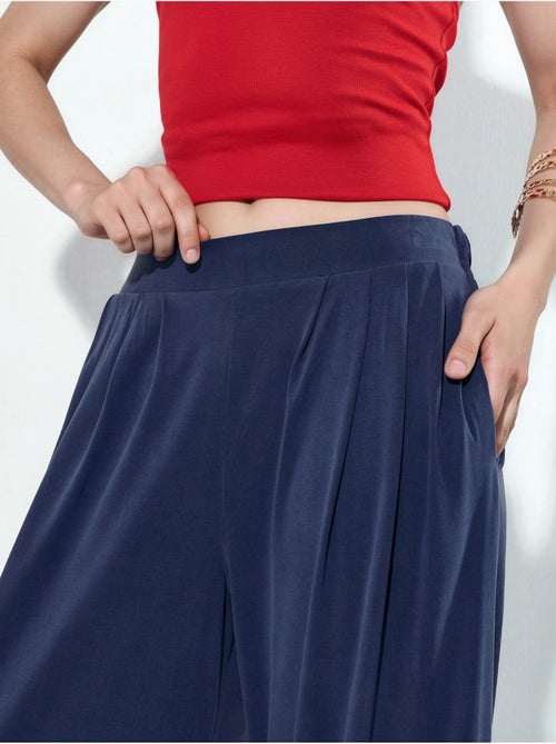 Geplooide wijde broek met zakken busem - Kiabi Geplooide wijde broek met zakken busem - Kiabi