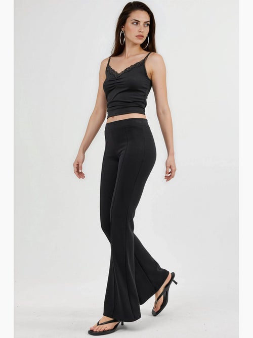 Geribde elastische flared broek busem - Kiabi Geribde elastische flared broek busem - Kiabi