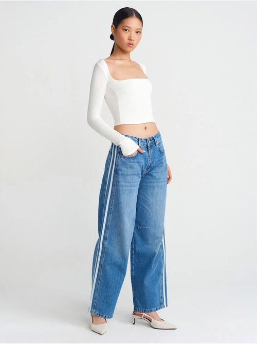 Gestreepte denim jeans met hoge taille en wijde pijp dilvin - Kiabi Gestreepte denim jeans met hoge taille en wijde pijp dilvin - Kiabi