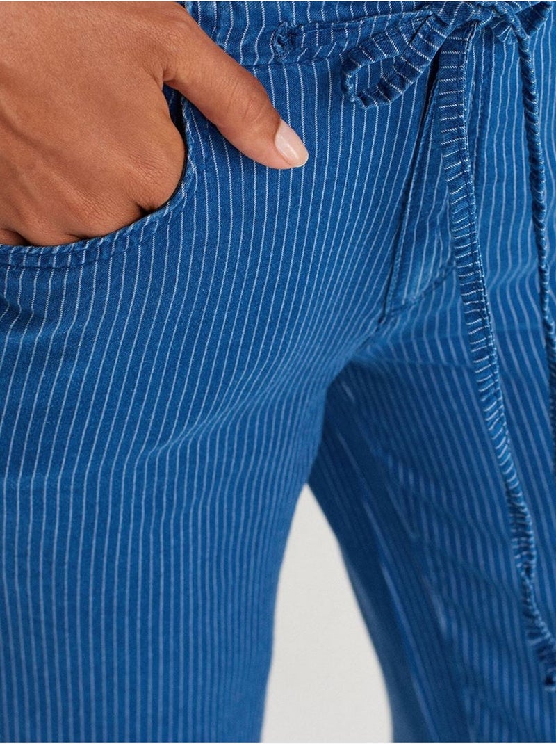 Gestreepte tenceljeans met wijde pijp en middelhoge taille dilvin Saffierblauw - Kiabi