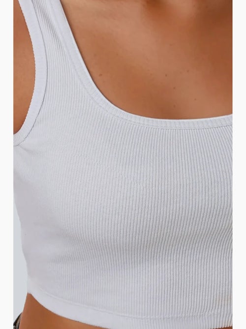 Getailleerde tanktop met ronde hals en cropped hals hiccup - Kiabi Getailleerde tanktop met ronde hals en cropped hals hiccup - Kiabi
