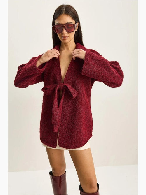 Getextureerd oversized vest met v-hals en striksluiting lucci - Kiabi Getextureerd oversized vest met v-hals en striksluiting lucci - Kiabi
