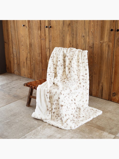 Gevlekte plaid met structuur en een achterkant van fluweel - Kiabi Gevlekte plaid met structuur en een achterkant van fluweel - Kiabi