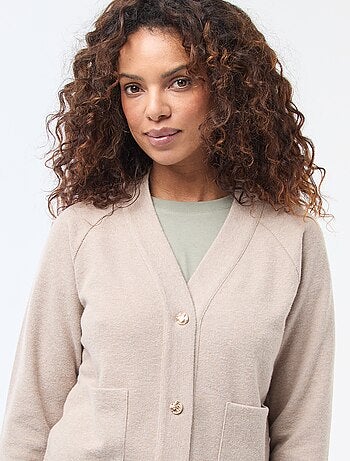 Gilet avec ouverture boutonnée dorée