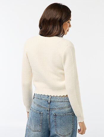 Gilet en maille grosse jauge avec boutons en forme de fleurs