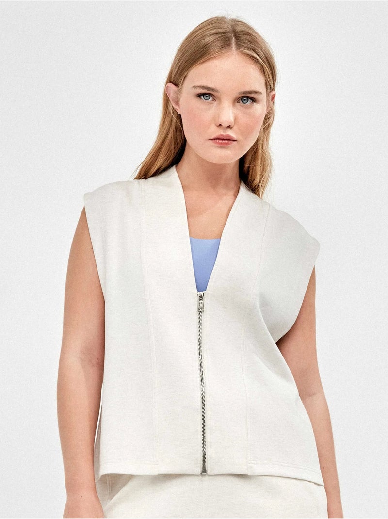 Gilet sportif double doux avec fermeture éclair frontale en couleur beige Beige - Kiabi