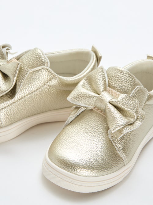 Goudkleurige slip-on schoenen / zonder veters met fantasie strikken - Kiabi Goudkleurige slip-on schoenen / zonder veters met fantasie strikken - Kiabi