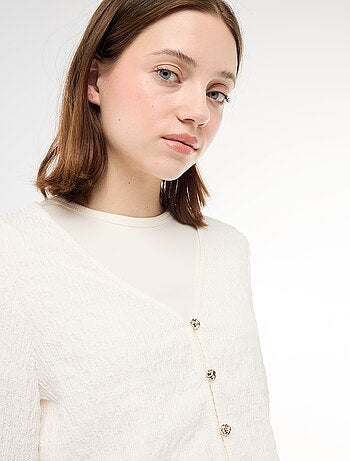 Haut col V en maille gaufrée avec boutons dorés