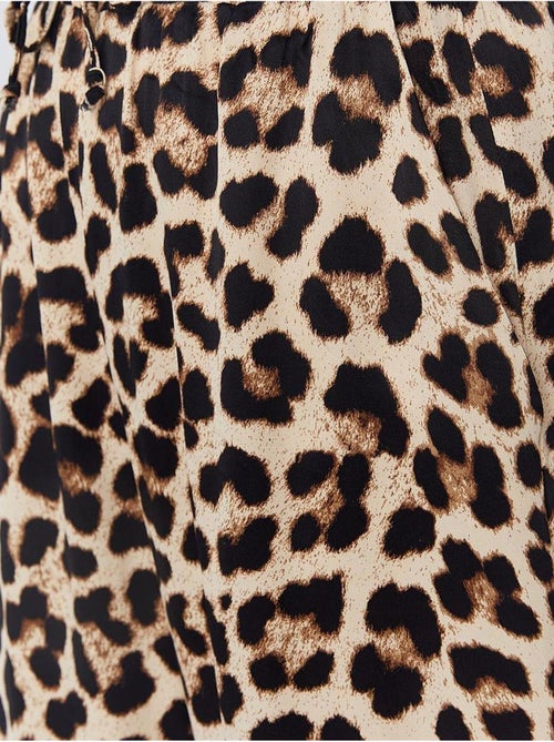 High-waist broek met luipaardprint en wijde pijpen mixray - Kiabi High-waist broek met luipaardprint en wijde pijpen mixray - Kiabi