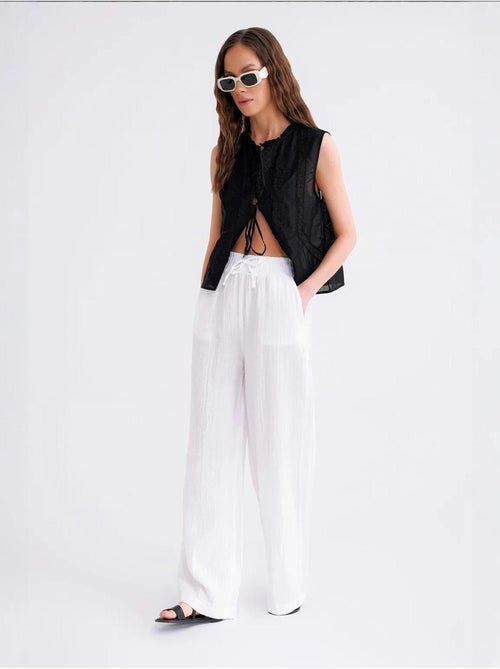 High waist broek van getextureerde mousselin mixray - Kiabi High waist broek van getextureerde mousselin mixray - Kiabi