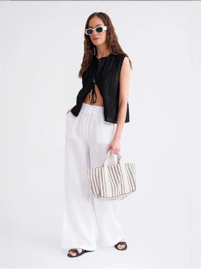High waist broek van getextureerde mousselin mixray Wit - Kiabi
