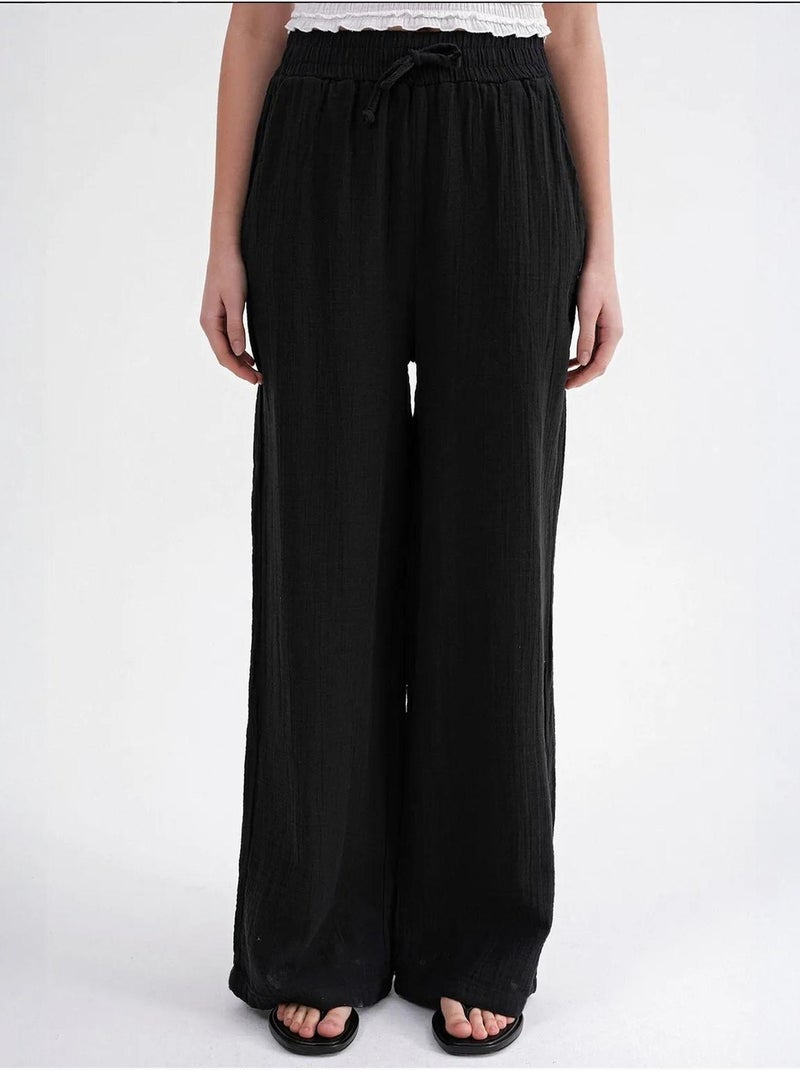 High waist broek van getextureerde mousselin mixray Zwart - Kiabi