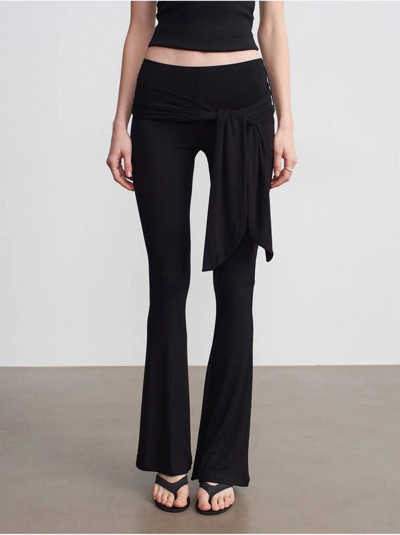High-waist flared jersey broek met strikdetail dilvin Zwart - Kiabi