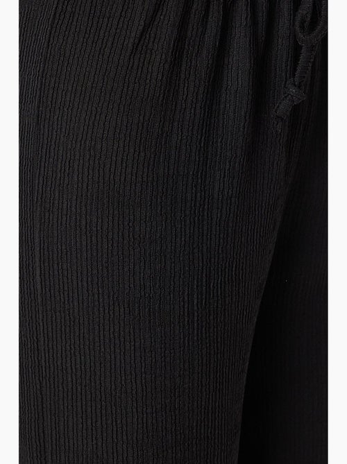 High-waist getextureerde broek met wijde pijpen istanbul - Kiabi High-waist getextureerde broek met wijde pijpen istanbul - Kiabi