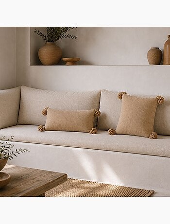 Housse de coussin en laine à pompons