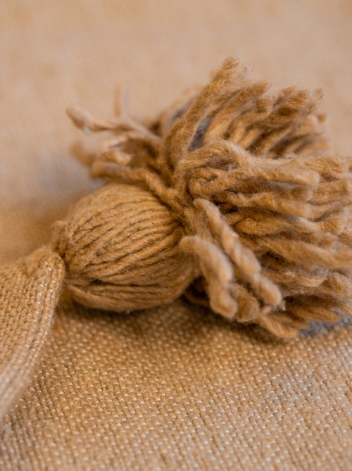 Housse de coussin en laine à pompons - Kiabi Housse de coussin en laine à pompons - Kiabi