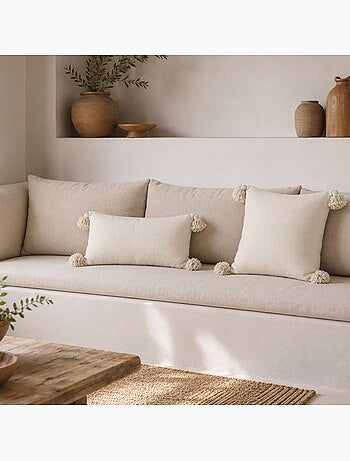 Housse de coussin en laine à pompons