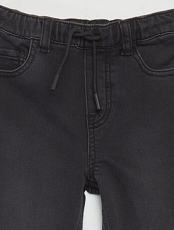 Jean à taille élastiquée avec cordons