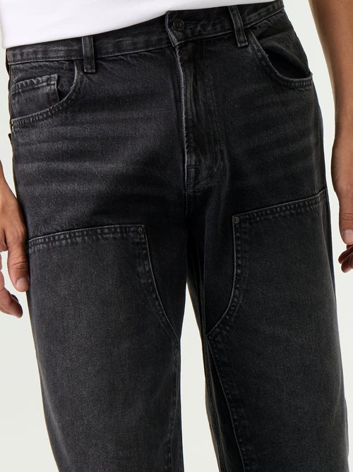Jean baggy uni avec empiècements fantaisies - Kiabi Jean baggy uni avec empiècements fantaisies - Kiabi