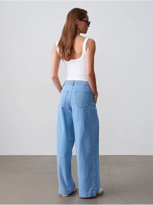 Jeans van katoen-denim met hoge taille en wijde pijp dilvin - Kiabi Jeans van katoen-denim met hoge taille en wijde pijp dilvin - Kiabi