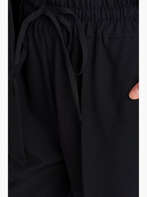 Jersey broek met wijde pijp dilvin - Kiabi Jersey broek met wijde pijp dilvin - Kiabi