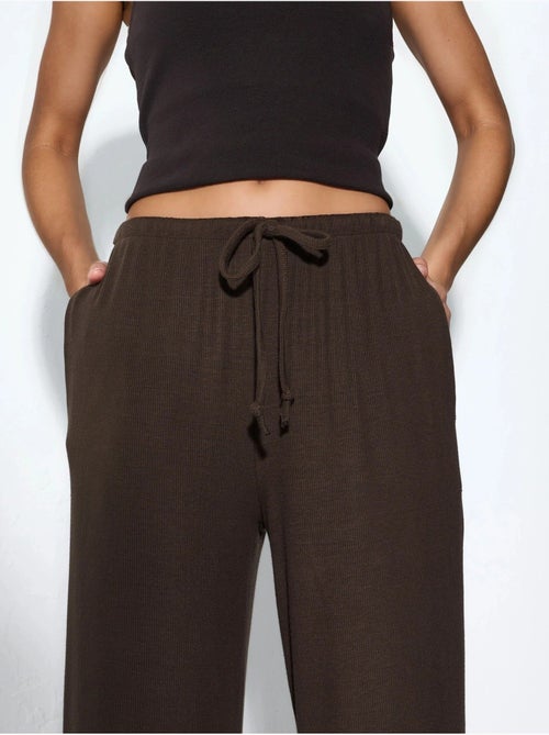 Jersey broek met wijde pijpen busem - Kiabi Jersey broek met wijde pijpen busem - Kiabi