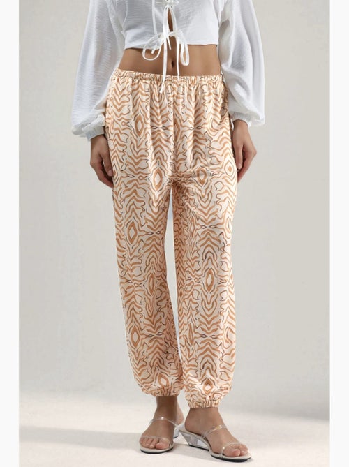 Joggerbroek met zebraprint en lage taille hiccup - Kiabi Joggerbroek met zebraprint en lage taille hiccup - Kiabi