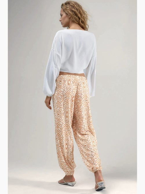 Joggerbroek met zebraprint en lage taille hiccup - Kiabi Joggerbroek met zebraprint en lage taille hiccup - Kiabi