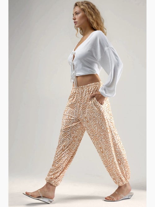 Joggerbroek met zebraprint en lage taille hiccup - Kiabi Joggerbroek met zebraprint en lage taille hiccup - Kiabi