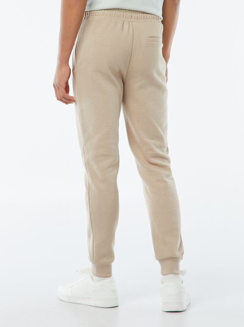 Jogging en molleton gratté avec 2 poches zippées - Kiabi