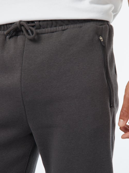 Jogging en molleton gratté avec 2 poches zippées - Kiabi