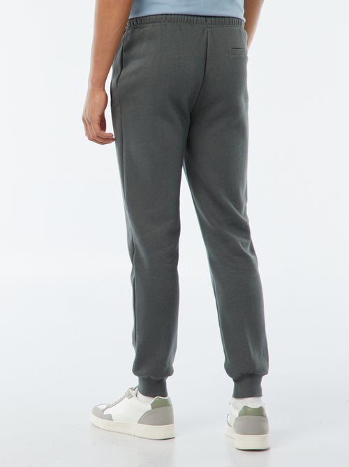 Jogging en molleton gratté avec 2 poches zippées - Kiabi