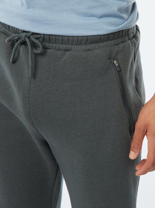 Jogging en molleton gratté avec 2 poches zippées - Kiabi