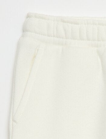 Jogging en molleton uni multi-poches