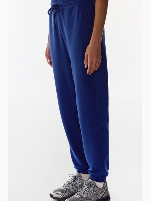 Joggingbroek met hoge taille en elastische boorden penti - Kiabi Joggingbroek met hoge taille en elastische boorden penti - Kiabi