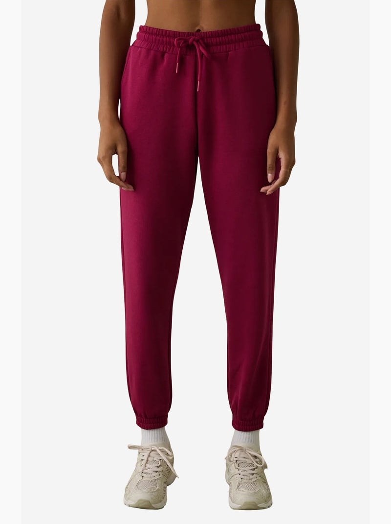 Joggingbroek met hoge taille en strikdetail, zacht geruwd penti Magenta - Kiabi