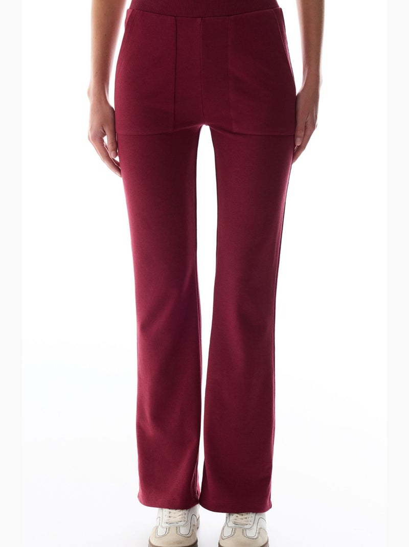 Joggingbroek met ribdetails en uitlopende pijp penti Bordeauxrood - Kiabi