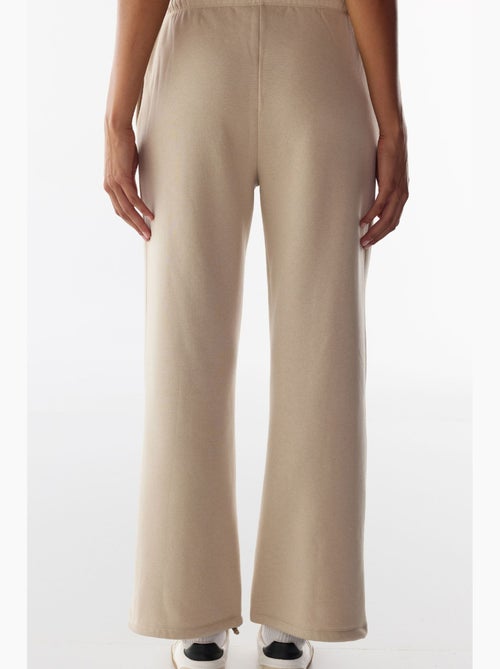 Joggingbroek met verstelbare taille en wijde pijp penti - Kiabi Joggingbroek met verstelbare taille en wijde pijp penti - Kiabi