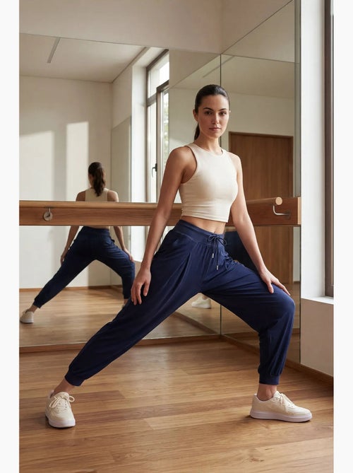 Joggingbroek van dunne jersey met middelhoge taille en zak tommy - Kiabi Joggingbroek van dunne jersey met middelhoge taille en zak tommy - Kiabi