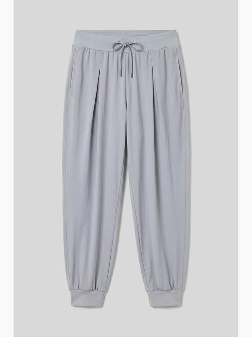 Joggingbroek van dunne jersey met middelhoge taille en zak tommy - Kiabi Joggingbroek van dunne jersey met middelhoge taille en zak tommy - Kiabi