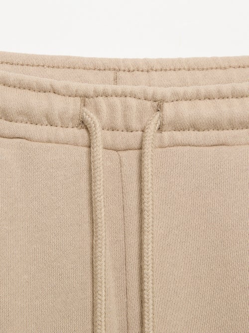 Joggingbroek van lichte molton met wijde pasvorm - gemakkelijk aan te trekken - Kiabi Joggingbroek van lichte molton met wijde pasvorm - gemakkelijk aan te trekken - Kiabi
