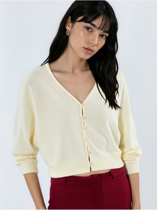 Kort geribd vest met v-hals busem - Kiabi Kort geribd vest met v-hals busem - Kiabi
