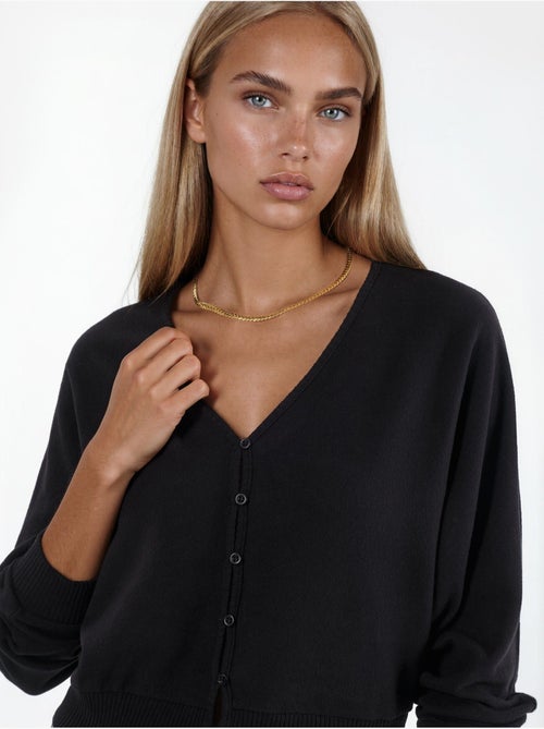 Kort geribd vest met v-hals busem - Kiabi Kort geribd vest met v-hals busem - Kiabi