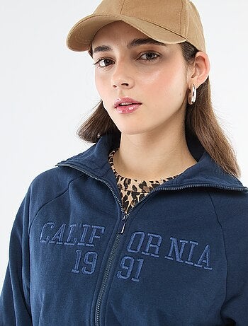 Kort sweatshirt met rits en geborduurde boodschap
