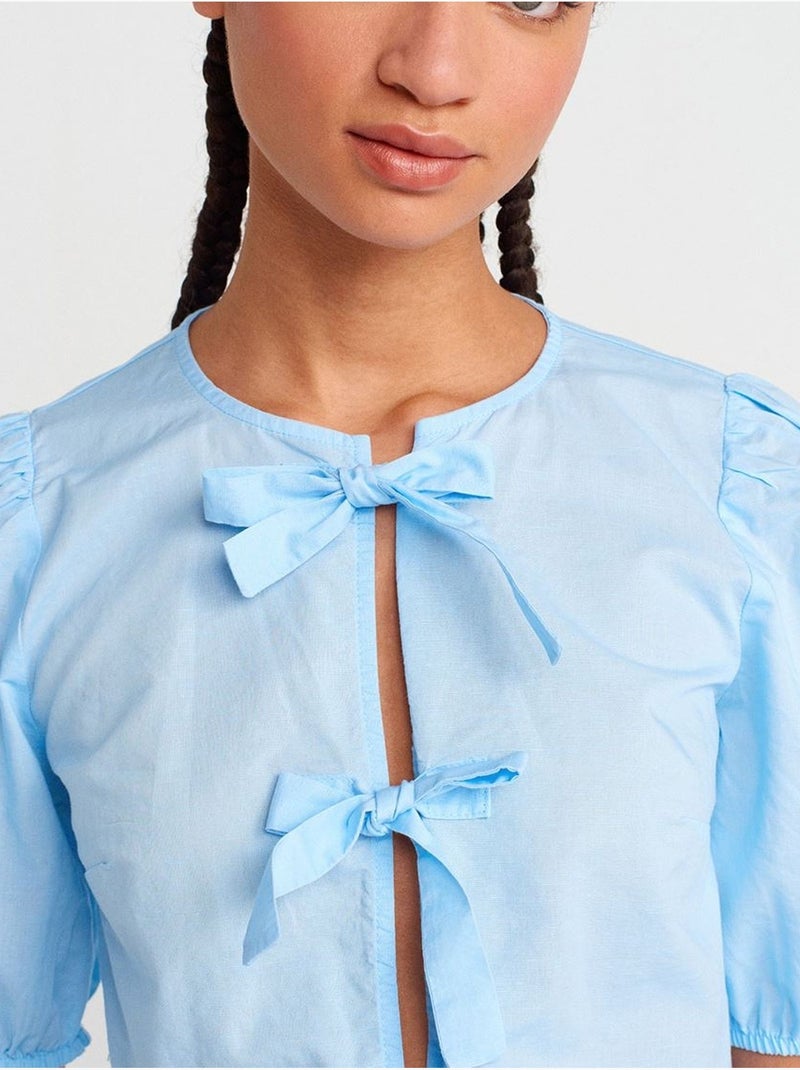 Korte damesblouse met strikdetail dilvin Hemelsblauw - Kiabi