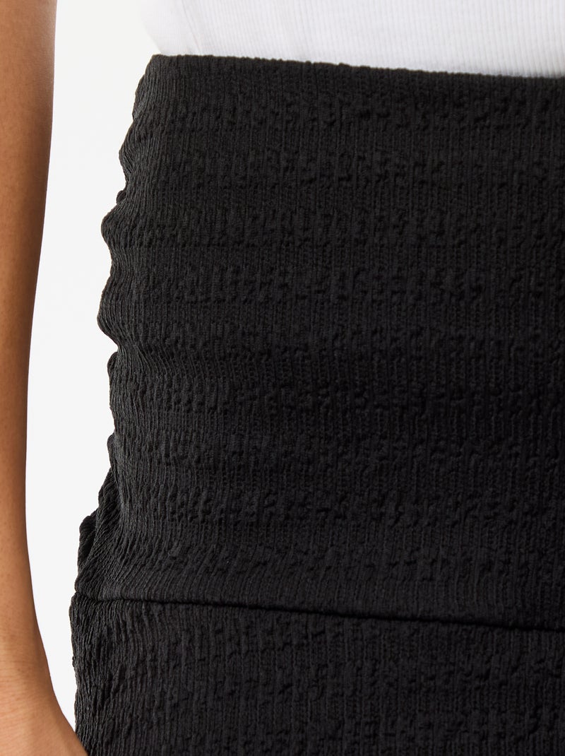 Korte rok met ruches van crinkle-breisel Zwart - Kiabi